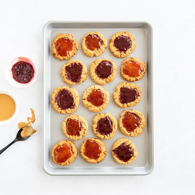 Nordic Ware Brilliant™ Colorful 4-Pc Baking Set, Nonstick made without PFAS or PTFE for safe cooking; Reinforced steel rim prevents warping; Half Sheet, 9x13 Inch Pan, 9-Inch Round Pan and Muffin Pan